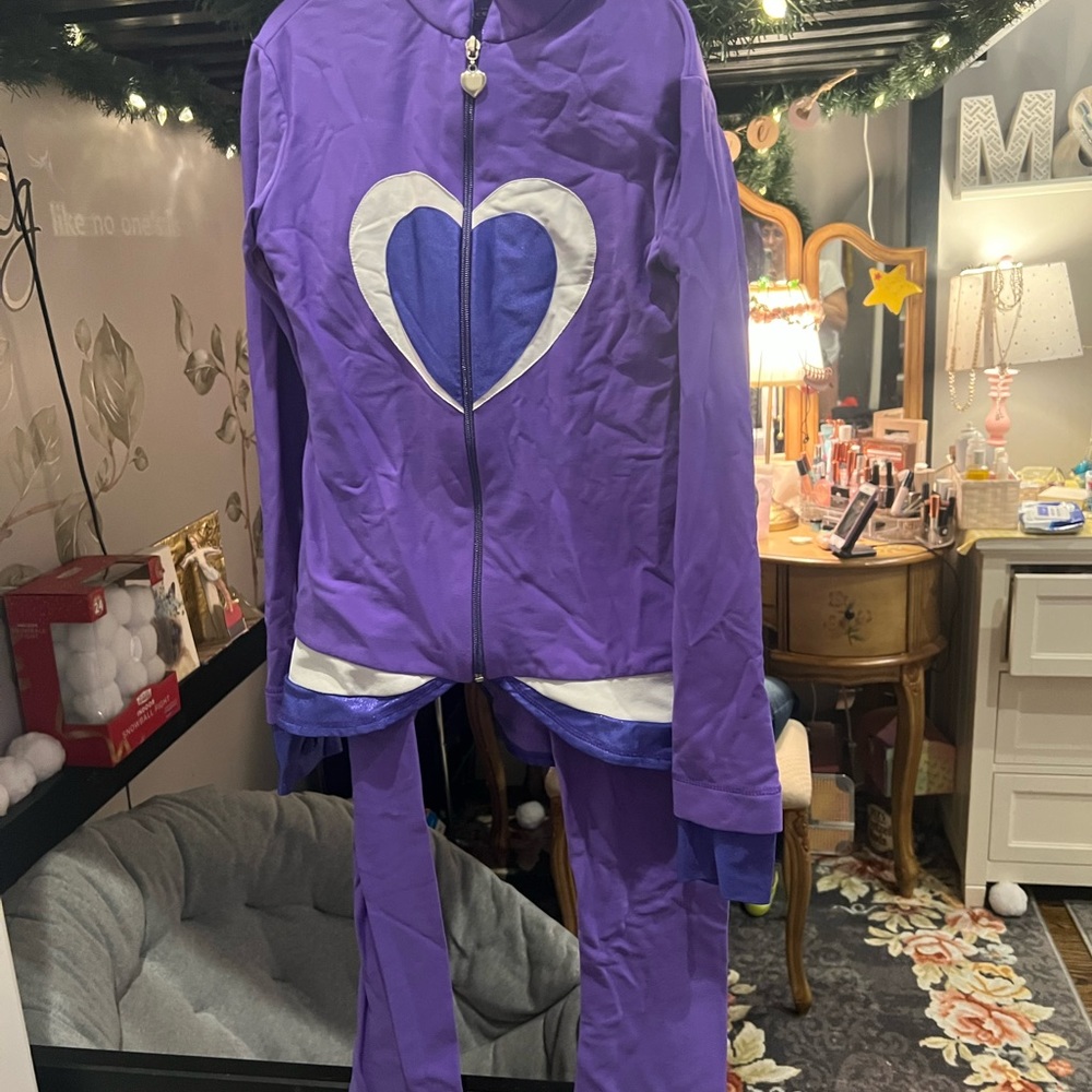 Purple adult x- small forgive skating trading suit.